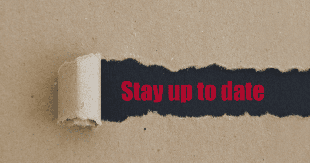 a brown paper image with a section torn away with letters underneath saying 'stay up to date'